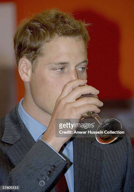 Prince William has a drink in the FA Club marquee before the FA Cup final between Liverpool and West Ham United at the Cardiff Millenium Stadium on...