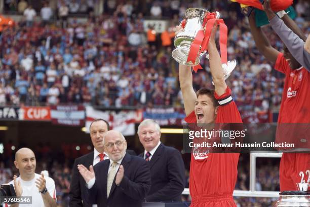 Liverpool captain Steven Gerrard raises the FA Cup trophy after the final between Liverpool and West Ham United at the Cardiff Millenium Stadium on...