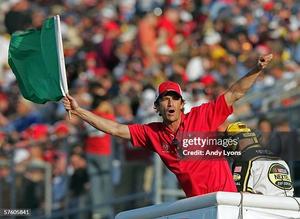 Actor Luke Perry waves the green flag before the start of the NASCAR Nextel Cup Series Dodge Charger 500 on May 13, 2006 at Darlington Raceway in...
