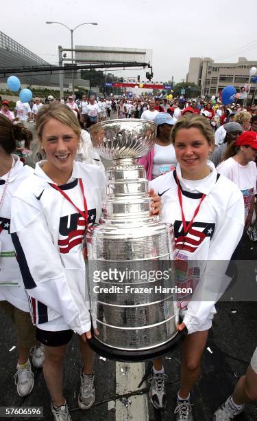 Members of the 2006 Olympic Women's Ice Hockey Team Helen Resor, and Sarah Parsons, carry the NHL Stanley Cup at the 13th Annual Revlon Run/Walk For...