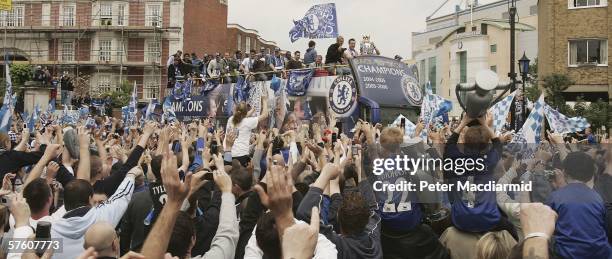 Chelsea captain John Terry holds the Premiership trophy as the team parade on an open top bus to celebrate winning the title on May 14, 2006 in...