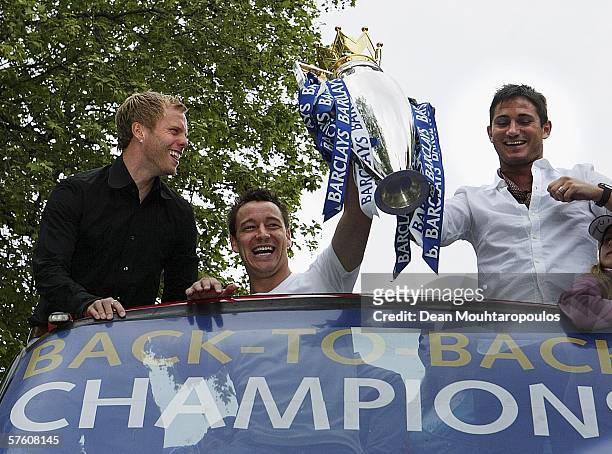 Eidur Gudjohnsen, John Terry and Frank Lampard show the Premiership Trophy to the fans on the open-topped bus parade of the Barclays Premiership...