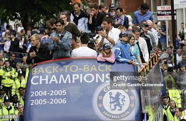 The Chelsea football team are seen on their open-topped bus parade of the Barclays Premiership trophy and the FA Community Shield as they make their...