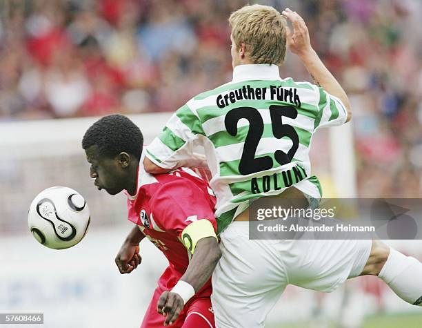 Soumaila Coulibaly of Freiburg competes with Daniel Adlung of Fuerth during the Second Bundesliga match between SC Freiburg and Greuther Fuerth at...