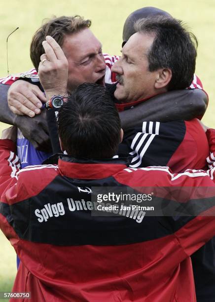 Harry Deutinger, the coach of SpVgg Unterhaching, hugs teammates after the Second Bundesliga match between SpVgg Unterhaching and VfL Bochum at the...