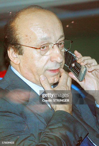 Juventus' general director Luciano Moggi phones as he leaves the San Nicola stadium in Bari after the Italian serie A football match Reggina vs...