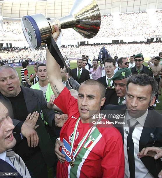 Fabio Cannavaro of Juventus holds up the title trophy after the Serie A match between Reggina and Juventus at the Stadio Granillo on May 14, 2006 in...