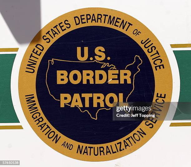 The U.S. Border Patrol emblem is seen on the side of an agent's truck patrolling the border May 14, 2006 in Nogales, Arizona. U.S. President George...