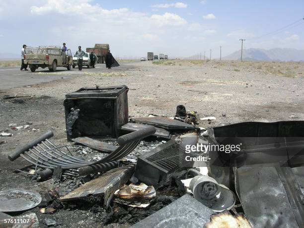 Remains of burnt cars are seen next to the Bam-Kerman road where twelve Iranians were shot in cold blood on the side of a highway, around 200...