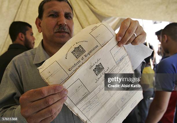 Palestinian refugee, Fayeq Abu Sa'da, stands in a protest tent during a rally ahead of the 58th anniversary of the Nakba on May 15, 2006 in Jabalya,...