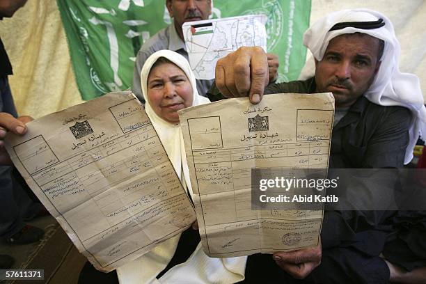 Palestinian refugee Abu Saed Abu Sa'da , and his wife Oum Saed Abu Sa'da sit in a protest tent during a rally ahead of the 58th anniversary of the...