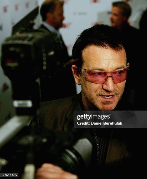 S frontman, Bono, is interviewed as he launches the red version of the new Motorola SLVR phone at the Carphone Warehouse, Oxford Street on May 15,...