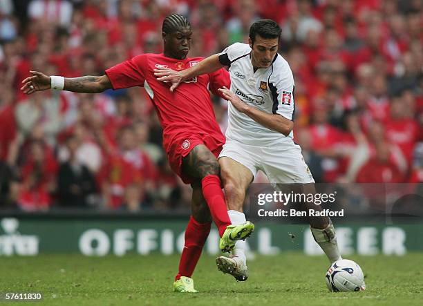 Djibril Cisse of Liverpool challenges Lionel Scaloni of West Ham United during the FA Cup Final match between Liverpool and West Ham United at the...