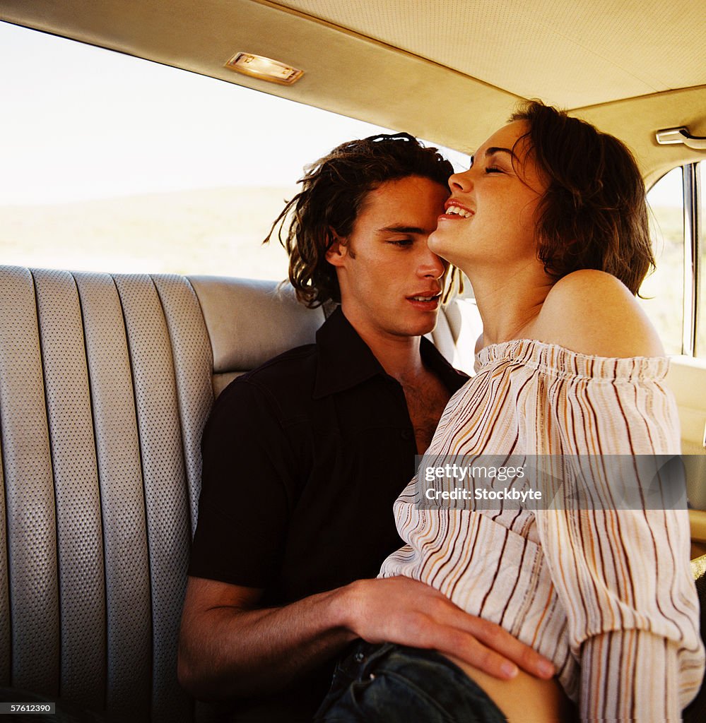 Closeup Of A Young Couple Making Out In The Back Seat Of A Car High Res