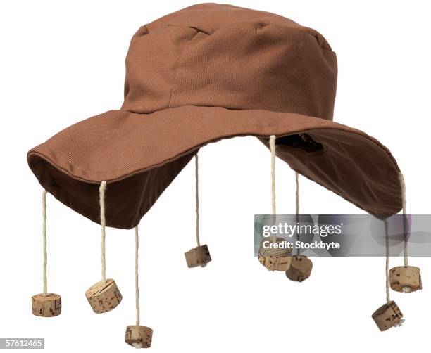 close-up of floppy hat with corks hanging from it - champagne cork stock pictures, royalty-free photos & images