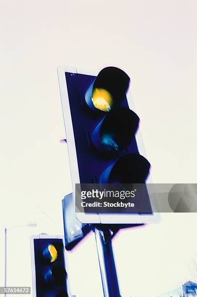 a traffic light turning yellow - yellow light effect stock pictures, royalty-free photos & images