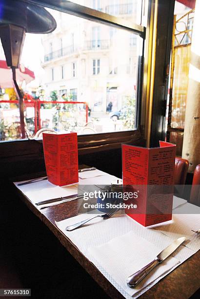 menu cards on a table in a restaurant - table eye level stock pictures, royalty-free photos & images