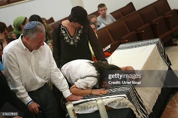 Amanda Wultz, sister of Florida teenager Daniel Wultz, cries over his coffin during a memorial ceremony for the 16-year-old Jewish youth May 15, 2006...