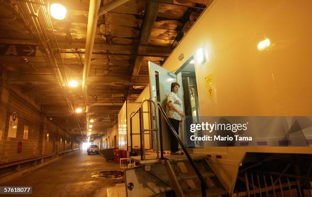 Technician stands in the doorway of a trailer where MRI scans are taken at Charity Hospital's makeshift emergency room which is located in an...