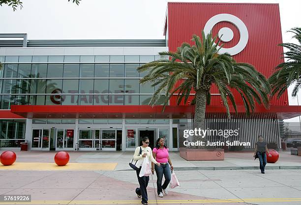 Customers carry bags as they leave a Target store May 15, 2006 in Albany, California. Target announced a 12 percent rise in profit in its quarterly...