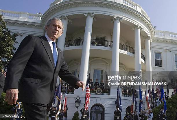 Washington, UNITED STATES: US President George W. Bush walks in front of the South Portico of White House during an official arrival ceremony for...