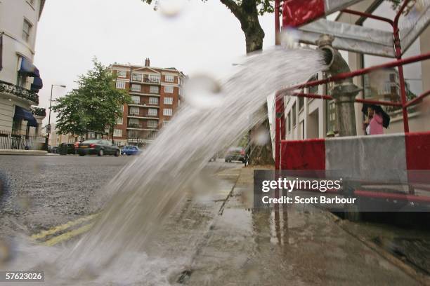 Burst pipe spews water onto a street near Lancaster Gate on May 16, 2006 in London, England. One of the driest periods in 70 years has caused...
