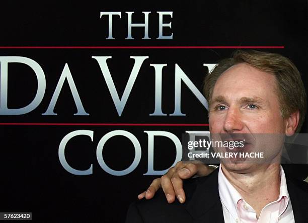 Author Dan Brown poses upon arriving at the Cannes train station, southern France, 16 May 2006, on the eve of the start of the 59th edition of the...