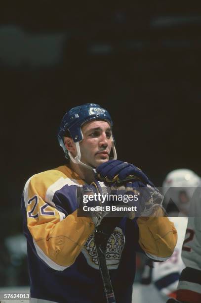 Canadian professional hockey player Dave 'Tiger' Williams of the Los Angeles Kings leans on his stick on the ice during a road game against the New...