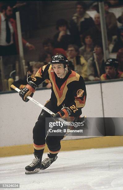 Canadian professional hockey player Dave 'Tiger' Williams of the Vancouver Canucks skates on the ice during a game against the New York Islanders,...