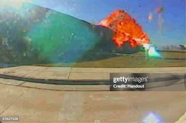 In this image taken from a Pentagon security camera video released May 16 an explosion is shown moments after American Airlines Flight 77 crashes...