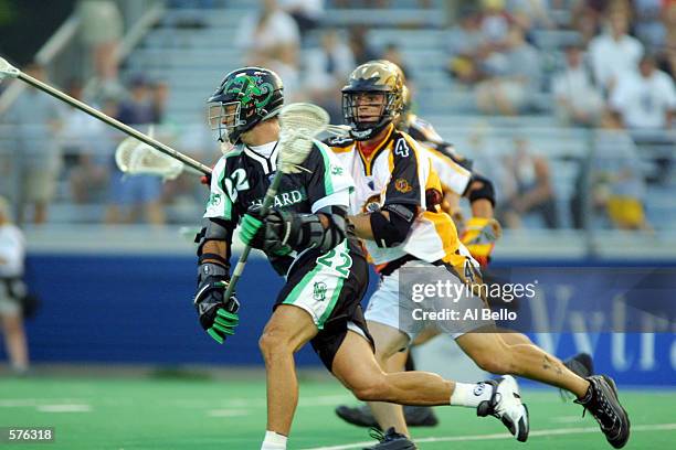Haugen of the Long Island Lizards runs with the ball against Casey Conner of the Rochester Rattlers during their Major League Lacrosse home opener...