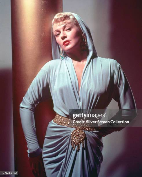 American actress Lana Turner wearing a hooded dress, circa 1950.