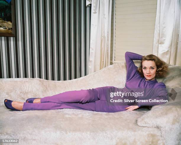 German actress Marlene Dietrich wearing a purple trouser suit, circa 1950.