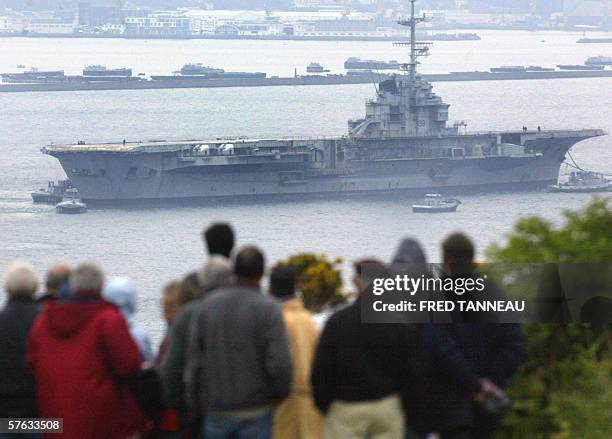 Hull 790 aka giant aircraft carrier Clemenceau, once a symbol of France's naval might, arrives, 17 May 2006, at the military seaport of Brest after...