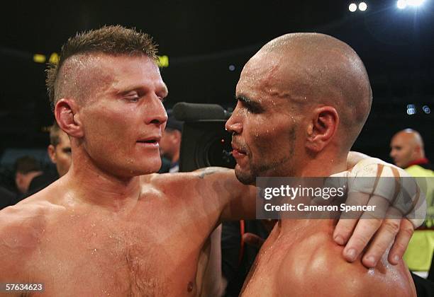 Anthony Mundine of Australia is congratulated by Danny Green of Australia after winning a unanimous points decision after their WBA...