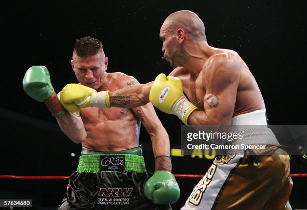 Anthony Mundine of Australia punches Danny Green of Australia during the WBA Super-Middleweight fight between Anthony Mundine of Australia and Danny...