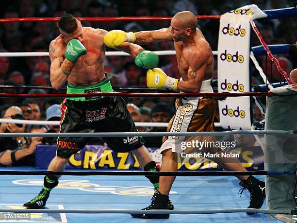 Anthony Mundine punches Danny Green during the WBA Super-Middleweight fight between Anthony Mundine of Australia and Danny Green of Australia at...