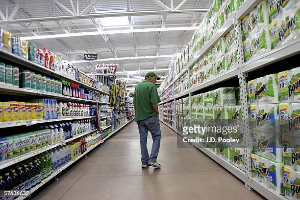 Man looks over items at the new 2,000 square foot Wal-Mart Supercenter store May 17, 2006 in Bowling Green, Ohio. The new store, one of three new...