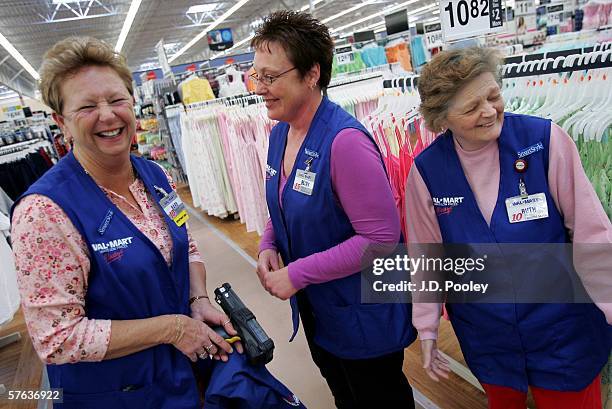 Barbara Kokensparger, who has been working with Wal-Mart for the past 11 years, shares a laugh with Becky Lientz, who has been with the company for...