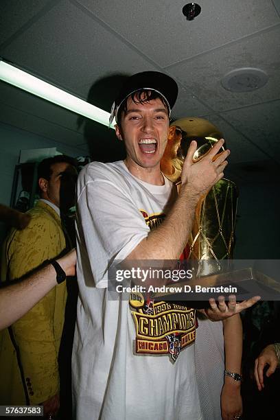 Toni Kukoc of the Chicago Bulls celebrates with the championship trophy after defeating the Seattle SuperSonics in Game Six of the NBA Finals at the...