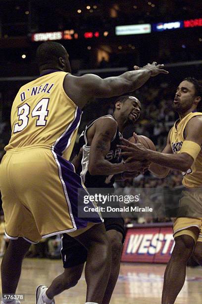 The Los Angeles Lakers defend David Robinson of the San Antonio Spurs in game four of the western conference finals at Staples Center in Los Angeles,...