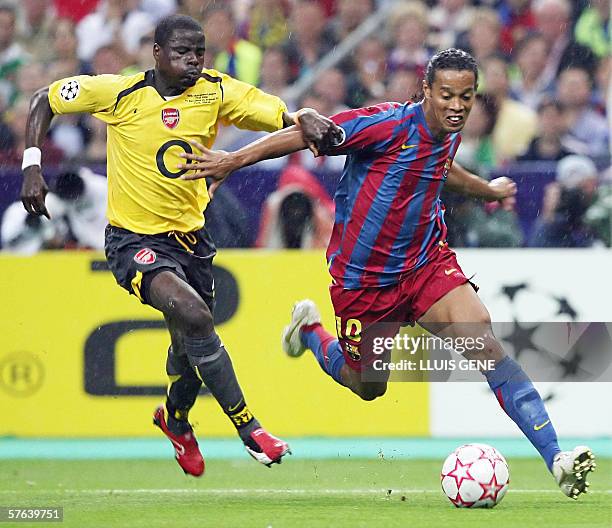 Barcelona's Brazilian forward Ronaldinho vies with Arsenal's defender Emmanuel Eboue during the UEFA Champion's League final football match Barcelona...