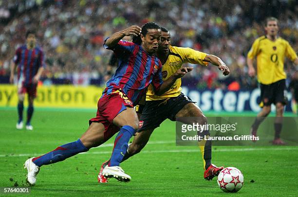 Ronaldinho of Barcelona challenges Ashley Cole of Arsenal during the UEFA Champions League Final between Arsenal and Barcelona at the Stade de France...