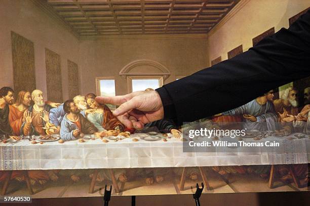 Father Gregory Fairbanks, a professor at St. Charles Borromeo Seminary in Philadelphia, points to John in a picture of "The Last Supper" by Leonardo...