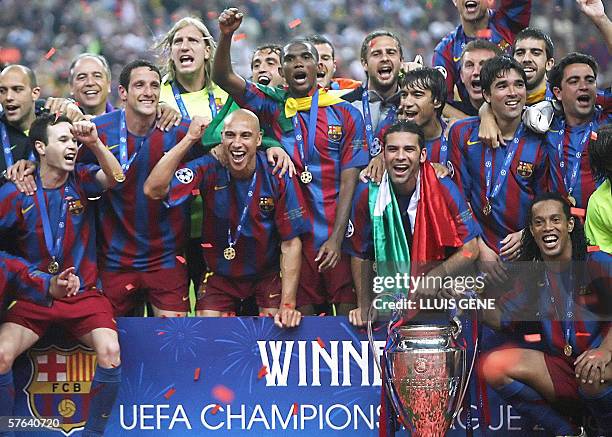 Barcelona's players celebrate with the trophy after winning the UEFA Champion's League final football match against. Arsenal, 17 May 2006 at the...