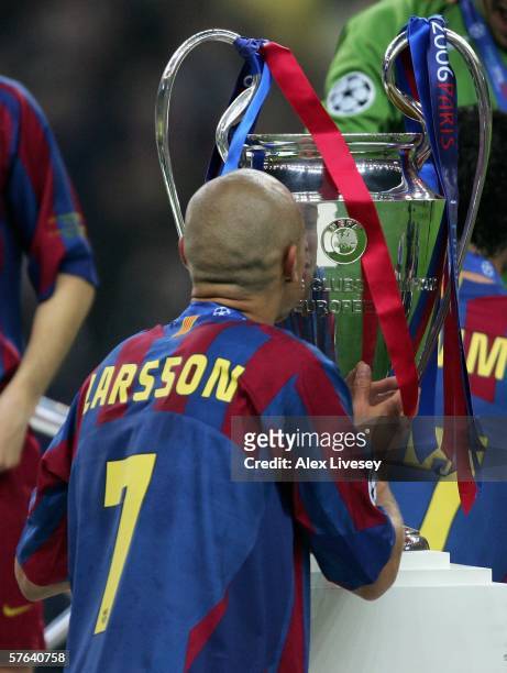 Henrik Larsson of Barcelona kisses the trophy after his team wins the UEFA Champions League Final between Arsenal and Barcelona at the Stade de...