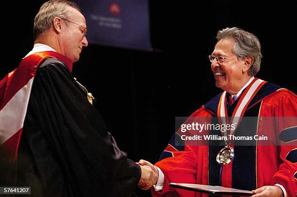 Academy Award winning actor William Hurt receives an Honorary Doctor of Arts Degree from University President Miguel Corzo during commencement...
