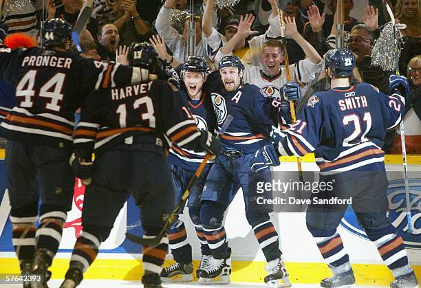 Shawn Horcoff and Ryan Smyth of the Edmonton Oilers celebrate with teammates after scoring the second goal against the San Jose Sharks in game six of...