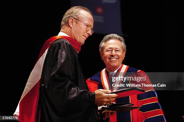 Academy Award winning actor William Hurt receives an Honorary Doctor of Arts Degree from University President Miguel Corzo during commencement...