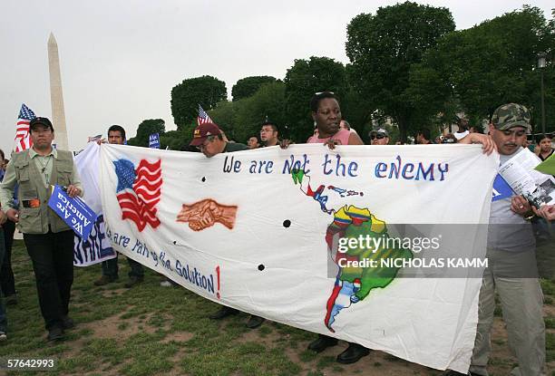 Washington, UNITED STATES: Hundreds of protesters rally 17 May on the National Mall in Washington, DC, to press Congress for immigration reform, just...